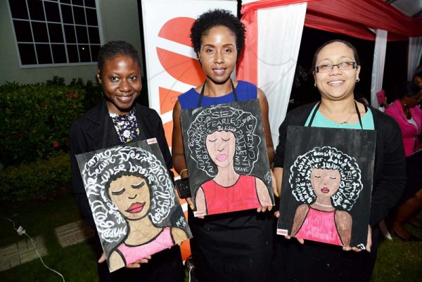 Rudolph Brown/ Photographer<\n>JMMB IWD sip and paint at JMMB 6 Haughton Terrace Kingston on Thursday, March 8, 2018<\n><\n>(Left) Talika Williamson, Lianna Black and Mellanie Didier celebrate International Women's Day by with beautifully painted art portraying a strong black woman.