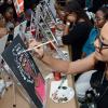 Rudolph Brown/ Photographer<\n>JMMB IWD sip and paint at JMMB 6 Haughton Terrace Kingston on Thursday, March 8, 2018<\n><\n>Lystra Sharp writes words of encouragment within the hair of her painting.
