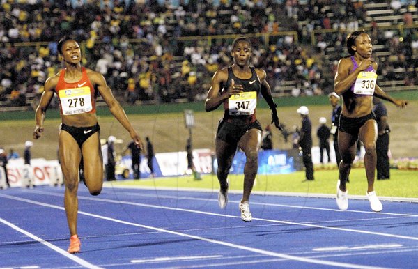 Ricardo Makyn/Staff Photographer
The United States' Carmelita Jeter (left) wins the women's 100 metres, while Jamaica's Kerron Stewart (centre) and Sherone Simpson lean for the finish, at the JN Jamaica International Invitational, at the National Stadium on Saturday night.


 7.5.2011