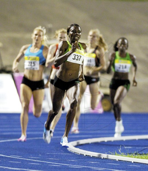 Ricardo Makyn/Staff Photographer
Jamaica's Kenia Sinclair sprints away from the field as she she drives towards the finish in the women's 800 metres, at the JN Jamaica International Invitational, at the National Stadium on Saturday night.


 7.5.2011