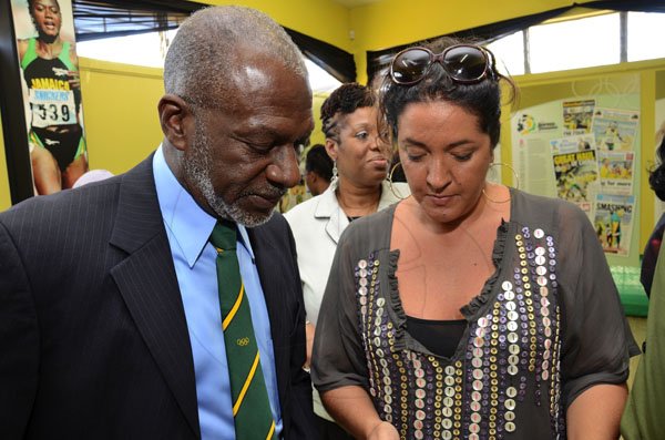 Rudolph Brown/Photographer
Curator of the Gleaner/Scotiabank archival exhibition 'The Journey of Champions: 50 Years of Jamaican Athletic Excellence', Susanne Fredricks (right) explains something to 1st vice president of the Jamaica Olympic Association Don Anderson during the exhibition launch at the St Catherine Parish Library yesterday.


 Launch of The Gleaner/Scotiabank Photo exhibition at St. Catherine Parish Library, Spanish Town on Wednesday, February 1-2012 

Launch of The Gleaner/Scotiabank Photo exhibition at St. Catherine Parish Library, Spanish Town on Wednesday, February 1-2012