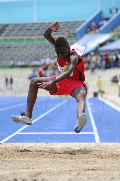 Ricardo Makyn/Staff Photographer
Jevaughn Taylor of Cockburn Pen winner of the Boys' Class 3 Long Jump with a leap of 5.72 Meter at the Junior High Schools track and field Championsips  2012 at the National Stadium day one at the National Stadium on Thursday 19.4.2012