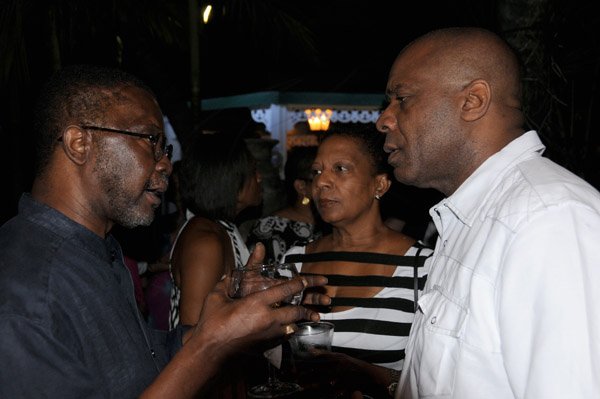 Winston Sill/Freelance Photographer
Guardsman Group Chairman Kenny Benjamin 60th Birthday  and  Appreciation Party with Family and a host of Friends,  held at Montgomery Road, Stony Hill on Saturday night July 13, 2013. Here are Nii Allotey Odunton (left), Secretary General, International  Seabed Authority; Jan Christie (centre); and Greg Christie (right).
