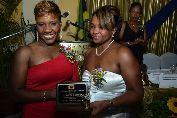 Rudolph Brown/Photographer
Immediate Past President Sharon Williams, (left) presents the Kiwanis of the year to Audrey Brown, Secretary at the Kiwanis Club of New Kingston Installation Banquet for the incoming President Lola Chin Sang for 2012 -2013, officers and Board of Directors at the Terra Nova Hotel in Kingston on Wednesday, October 10, 2012