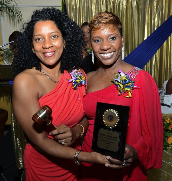 Rudolph Brown/Photographer
BUSINESS
Immediate Past President Sharon Williams, (left) pass on the gavel to incoming President Lola Chin Sang at the Kiwanis Club of New Kingston Installation Banquet for the 2012 -2013, officers and Board of Directors at the Terra Nova Hotel in Kingston on Wednesday, October 10, 2012