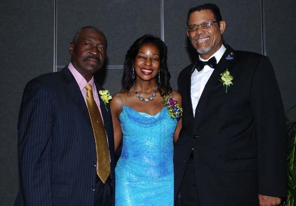 Colin Hamilton/Freelance Photographer
A rose among thorns, Andrea Williams with IPP Lt. Gov. Llewellyn Allen (L) and Lt. Gov. Stanley Dunwell (R) during the Kiwanis Club of New Kingston Installation Banquet at the Jamaica Pegasus on Wednesday October 12, 2011.