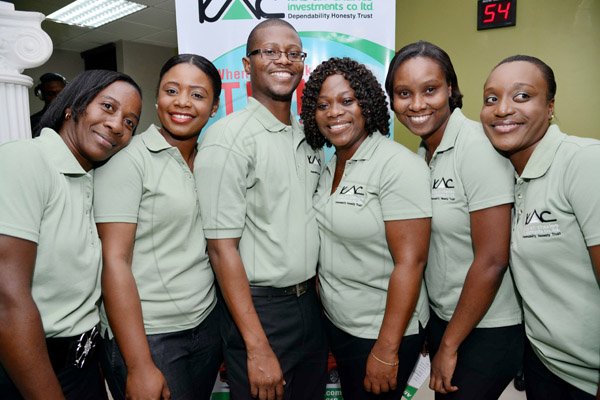 Rudolph Brown/Photographer
Luke Henry pose with from left Kavel Harris, Temerin Lawrence, Maxine Chevannes, Dania Binns and Opal Hutchinson at the  official open of Kris An Charles Investment Company Limited new office at the launch on 2 Eureka Crescent in Kingston on Thursday, September 5, 2013
