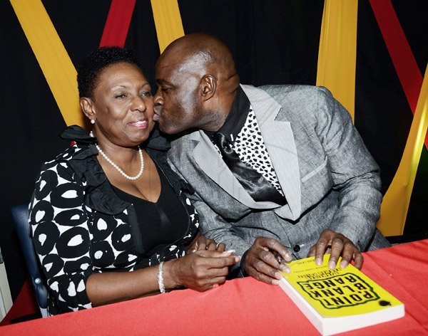 Winston Sill

Isaiah Laing (right) kisses Olivia 'Babsy' Grange on the cheek at the launch of the former policeman's book 'Point Blank Range: A Bad Man Police - The Isaiah Laing Story' at the Police Officers Club, Hope Road, St Andrew, on Wednesday evening.