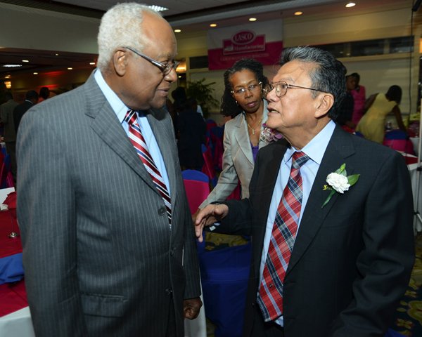 Rudolph Brown/Photographer
BUSINESS DESK
Lester Spaulding, (left) chairman of the RJR Group chat with Lascelles Chin (right), executive chairman of LASCO Affiliated Companies at the LASCO 2012-2013 Teacher and Principal of the Year Awards at the Wyndham Hotel in New Kingston on Tuesday, December 4, 2012