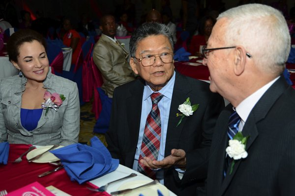 Rudolph Brown/Photographer
BUSINESS DESK
Rev. Ronald Thwaites, (right) Minister of Education in discussion with Lascelles Chin, executive chairman of LASCO Affiliated Companies and Dr. Eileen Chin, (left) Managing Director, LASCO Manufacturing at the LASCO 2012-2013 Teacher and Principal of the Year Awards at the Wyndham Hotel in New Kingston on Tuesday, December 4, 2012