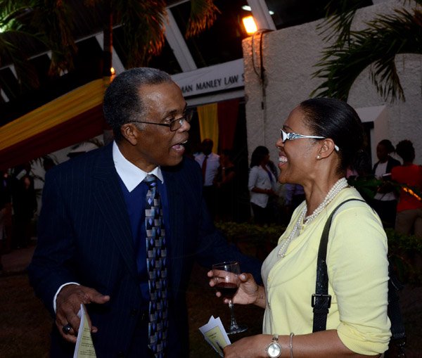 Winston Sill/Freelance Photographer
The Council of Legal Education, Norman Manley Law School 40th Anniversary Distinguished Lecture given by Derek Jones, and Graduation Ceremony of The Class of 1988, held at UWI, Mona Campus on Wednesday night March 19, 2014. Here are Attorneys Dr. Paul Ashley (left); and Dianne Edwards (right).