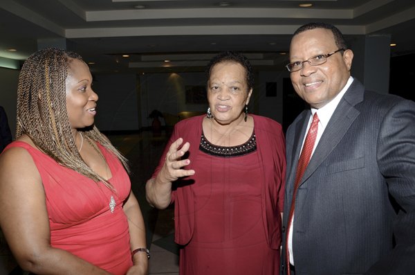 Rudolph Brown/Photographer
Dr Barbara Gloudon, (centre) chat with Rochey Allen and his wife Doreen at the Lay Magistrates Association of Jamaica (Kingston Chapter) Annual Banquet at the Wyndam Kingston Hotel on Saturday, September 24-2011