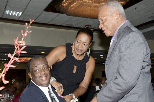 Rudolph Brown/Photographer
Hotelier Glen Bromfield (right), catches up with Andrea Francis and Sunshine Auto's Errol Brennan.

************************************************************************** at the Lay Magistrates Association of Jamaica (Kingston Chapter) Annual Banquet at the Wyndam Kingston Hotel on Saturday, September 24-2011