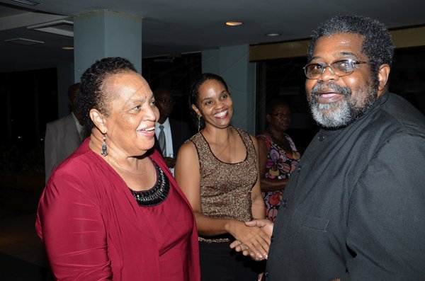 Rudolph Brown/Photographer
Dr Barbara Gloudon, (left) and her daughter Anya Gloudon greeted by Dr. Aggrey Irons at the Lay Magistrates Association of Jamaica (Kingston Chapter) Annual Banquet at the Wyndam Kingston Hotel on Saturday, September 24-2011