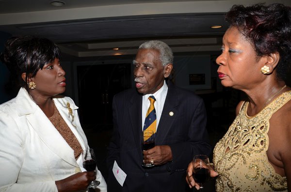 Rudolph Brown/Photographer
Joan McDonald, (left) chat with Laker Levers and Dr Paulette MeGregor at the Lay Magistrates Association of Jamaica (Kingston Chapter) Annual Banquet at the Wyndam Kingston Hotel on Saturday, September 24-2011