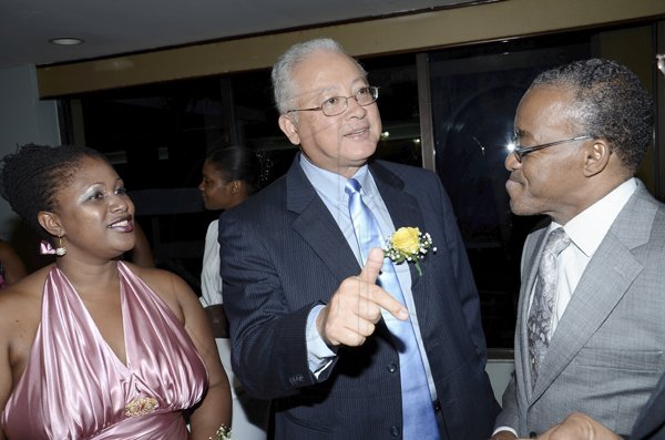 Rudolph Brown/Photographer
 Delroy Chuck (centre) 


***********************************************************inister of Justice makes his point to  Johanthan Brown and Roxanna Harriot.

********************************************************************* at the Lay Magistrates Association of Jamaica (Kingston Chapter) Annual Banquet at the Wyndam Kingston Hotel on Saturday, September 24-2011