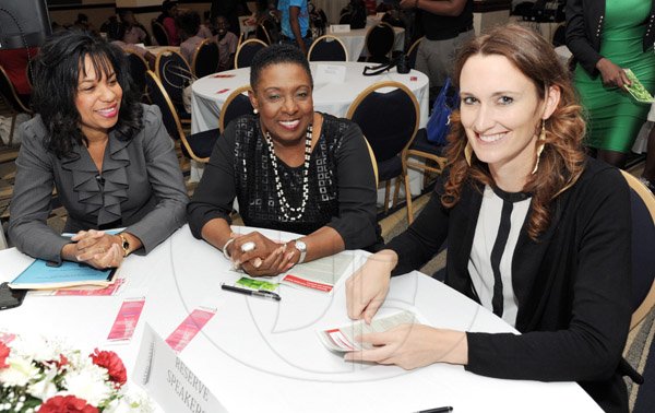 Rudolph Brown/Photographer
Olivia Grange, (centre) chat with Dr. Lanie Marie Oakley-Williams, (left) and Melanie Subratie at the Leaders to Leaders 2014-2015 Series "The Power of Sisterhood Fostering a culture of mentorship at the Jamaica Pegasus Hotel in New Kingston on Wednesday, September 24, 2014