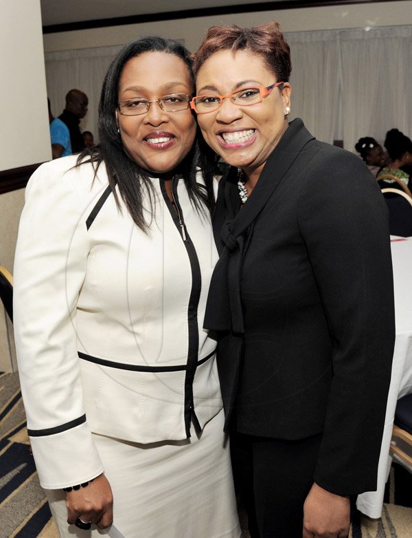 Rudolph Brown/Photographer
Grace Burnett, (left) Managing Director of JIIC pose with Gail Abrahams, Columbus Communications Director of Corporate Communications at the Leaders to Leaders 2014-2015 Series "The Power of Sisterhood Fostering a culture of mentorship at the Jamaica Pegasus Hotel in New Kingston on Wednesday, September 24, 2014