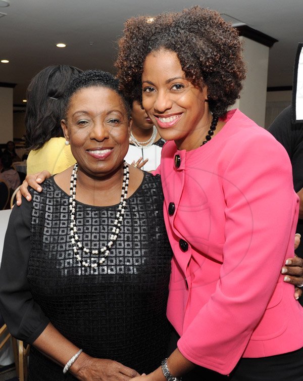 Rudolph Brown/Photographer
Olivia Grange, (left) greets Senator Imani Duncan-Price at the Leaders to Leaders 2014-2015 Series "The Power of Sisterhood Fostering a culture of mentorship at the Jamaica Pegasus Hotel in New Kingston on Wednesday, September 24, 2014