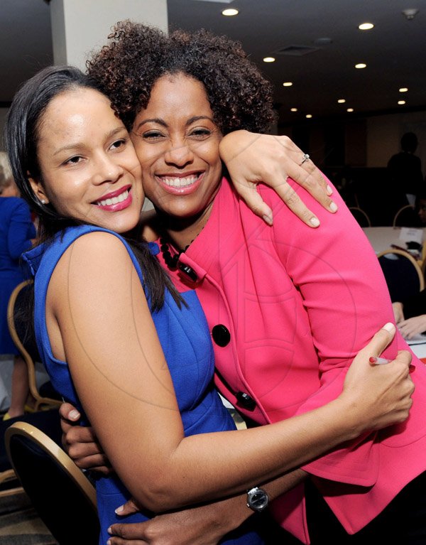 Rudolph Brown/Photographer
Gail Moss Solomon, (left) Head Legal, Regulatory Division Digicel greets Senator Imani Duncan-Price at the Leaders to Leaders 2014-2015 Series "The Power of Sisterhood Fostering a culture of mentorship at the Jamaica Pegasus Hotel in New Kingston on Wednesday, September 24, 2014
