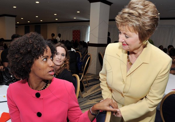 Rudolph Brown/Photographer
Becky Stockhausen, (right) chat with Senator Imani Duncan-Price at the Leaders to Leaders 2014-2015 Series "The Power of Sisterhood Fostering a culture of mentorship at the Jamaica Pegasus Hotel in New Kingston on Wednesday, September 24, 2014