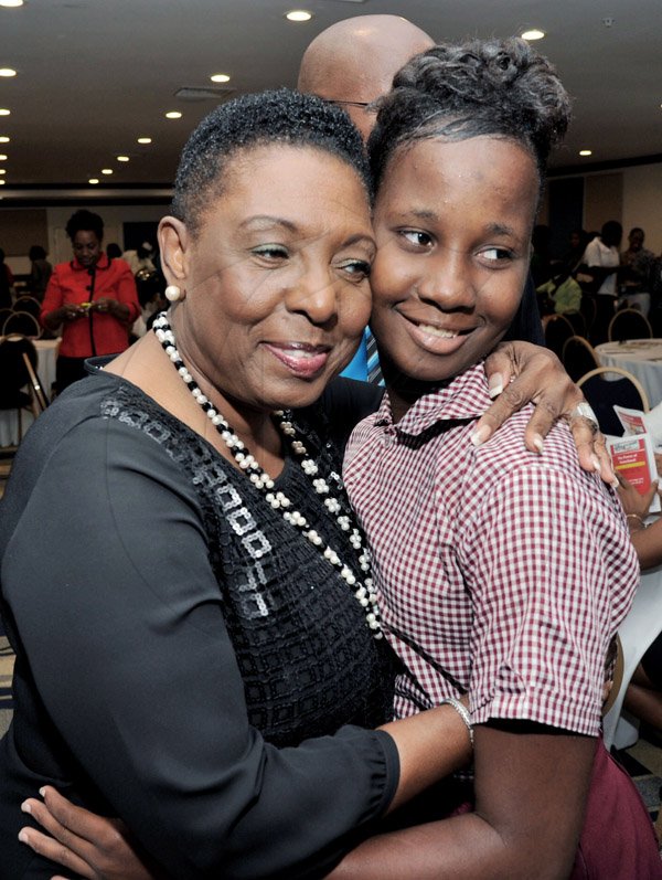 Rudolph Brown/Photographer
Olivia Grange, (left) greets Patricia Levy at the Leaders to Leaders 2014-2015 Series "The Power of Sisterhood Fostering a culture of mentorship at the Jamaica Pegasus Hotel in New Kingston on Wednesday, September 24, 2014