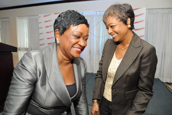 Rudolph Brown/Photographer
Minna Isreal, (left) share a Joke with Senator Marlene Malahoo Forte at the Leaders to Leaders 2014-2015 Series "The Power of Sisterhood Fostering a culture of mentorship at the Jamaica Pegasus Hotel in New Kingston on Wednesday, September 24, 2014