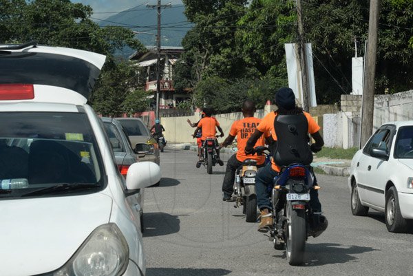 Jermaine Barnaby/Freelance Photographer
Some PNP bikers in August Town during the local Government election on Monday November 28, 2016.