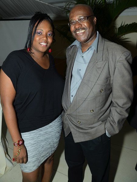 Rudolph Brown/Photographer
Camise Williams pose with Winston Fletcher, President  at the credit union's 35th anniversary 30th annual long service awards luncheon  at the Terra Nova Hotel in Kingston on Wednesday, December 5,2012