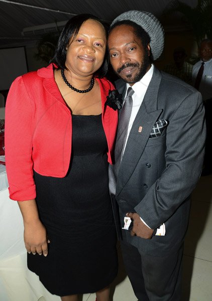 Rudolph Brown/Photographer
Sandra Thompson, general manager of St. Catherine Credit Union with Donavon Campbell at the credit union's 35th anniversary annual long service awards luncheon  at the Terra Nova Hotel in Kingston on Wednesday, December 5,2012