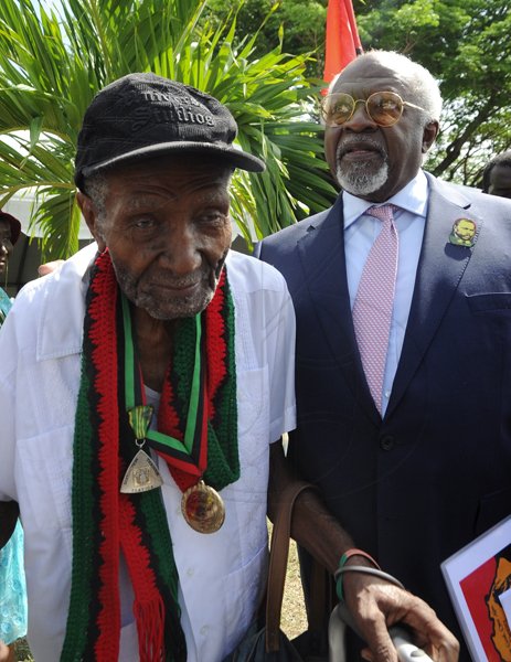 Rudolph Brown/Photographer
Julius Garvey, (left) son of the Marcus Mosiah Garvey greets Frank Gordon at the Floral Tribute commemorating the 125th Anniversary of the birth The Rt. Excellent Marcus Mosiah Garvey, Jamaica National Hero at the National Heroes Park in Kingston on Friday, August 17-2012