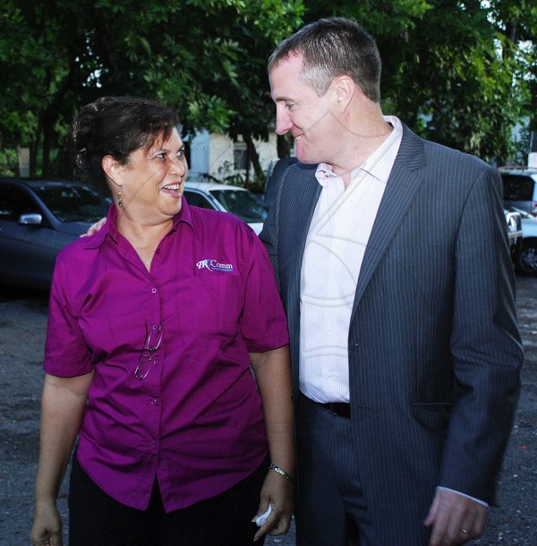 Colin Hamilton/Freelance Photographer
PROComm hosted a farewell cocktail party for departing Digicel CEO Mark Linehan and member of staff Staci Smith at their Kingsway Ave office on Wednesday August 22, 2012.
PROComm's Angela Foote escorts Digicel CEO Mark Linehan into the party.