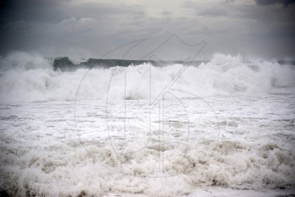 Gladstone Taylor/ Photographerscores of persons flocked to the Palisadoes strip on Monday september 3, 2016 to view the large waves crashing along the shoreline.