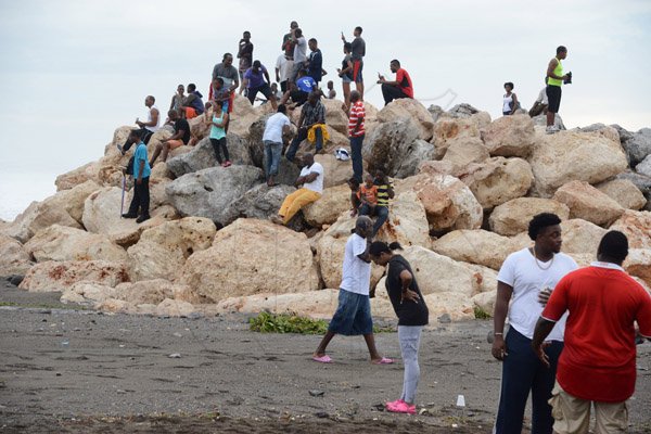 Gladstone Taylor/ Photographerscores of persons flocked to the Palisadoes strip on Monday september 3, 2016 to view the large waves crashing along the shoreline.