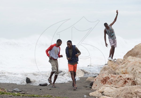 Gladstone Taylor/ Photographerscores of persons flocked to the Palisadoes strip on Monday september 3, 2016 to view the large waves crashing along the shoreline.