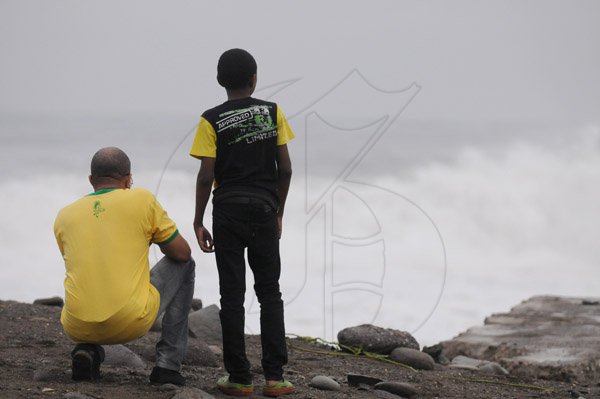 Gladstone Taylor/ Photographerscores of persons flocked to the Palisadoes strip on Monday september 3, 2016 to view the large waves crashing along the shoreline.