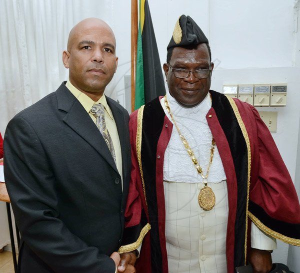 Rudolph Brown/Photographer
James Robertson greets His Worship the Mayor Ludlow Mathison at the Investiture ceremony for the conferment of Titles of Mayor and Deputy Mayor of Morant Bay at Casa Lagoona Hotel, Pamphret St. Thomas on Wednesday, May 14, 2014