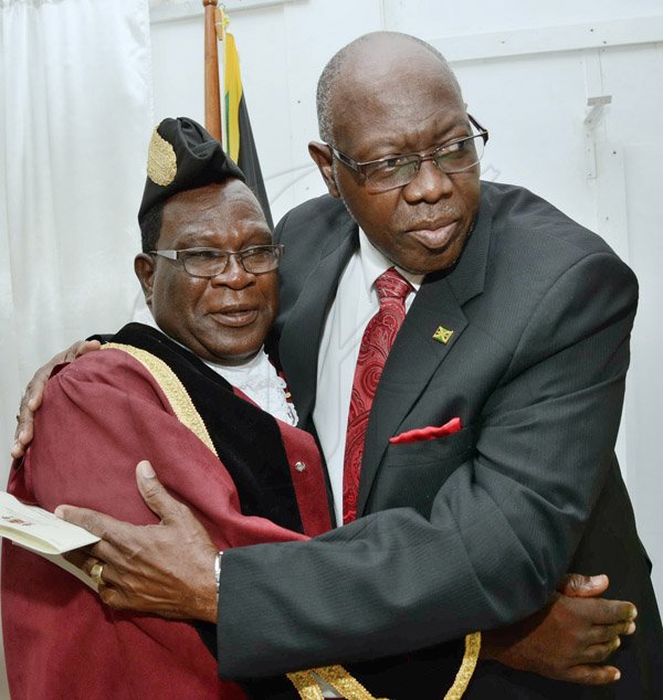 Rudolph Brown/Photographer
Minister of Health Dr Fenton Ferguson greets His Worship the Mayor Ludlow Mathison at the Investiture ceremony for the conferment of Titles of Mayor and Deputy Mayor of Morant Bay at Casa Lagoona Hotel, Pamphret St. Thomas on Wednesday, May 14, 2014