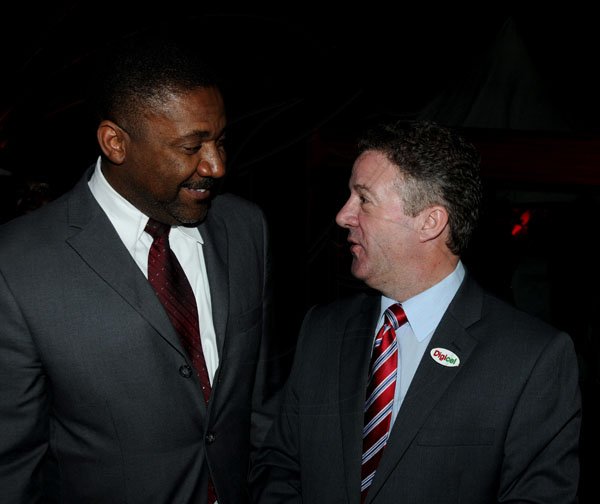 Winston Sill / Freelance Photographer
Digicel and Huawei presents the launch of the new Huawei Media Pad, held at Devon House, Hope Road on Monday night November 12, 2012. Here are Minister Phillip Paulwell (left); and Andy Thorburn (right), CEO, Digicel.