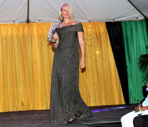 Ashley Anguin<\n>Sherry DaRosa, channeled her cover girl persona as she takes to the runway last Saturday night at the Montego Bay Chamber of Commerce and Industry's Food, Fashion and Dance.
