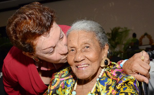 Rudolph Brown/Photographer
Marglaw Butler, (lef) kiss her 95 year old second mother Flaures Powell at the Jamaica Pegasus Hotel Mothers Day celebration brunch at Pegasus on Sunday, May 8, 2016