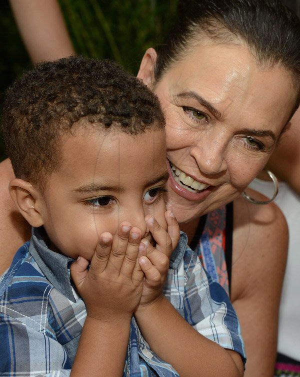 Rudolph Brown/Photographer
Cindy Breakspeare, plays with her grandson Grandson Joshua at the Boone Hall Oasis Mother Day brunch in Stony Hill on Sunday, May 11, 2014