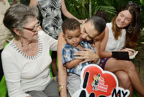Rudolph Brown/Photographer
Cindy Breakspeare, (centre) play with her grandson Grandson Joshua while Grandma Marguerite Spence (left) and Tammy Tavares Finson looks on at the Boone Hall Oasis Mother Day brunch in Stony Hill on Sunday, May 11, 2014