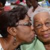Rudolph Brown/Photographer
Rudy Miller, (left) give her mother Melrose Blair-Miller a kiss at the St Michael's Anglican Church Kingston Annual Mother's Day Brunch at the Rectory on Tucker Avenue
Sunday, May 11, 2014