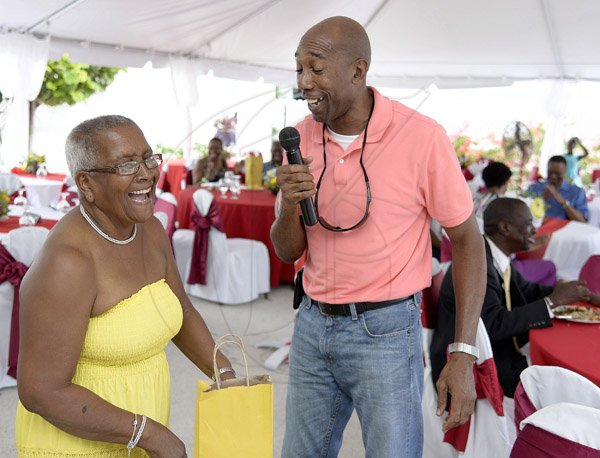 Gladstone Taylor / Photographer

Walter Brown (right) serenades Winsome Dawson as seen at the mothers day brunch at the oasis on the oxford