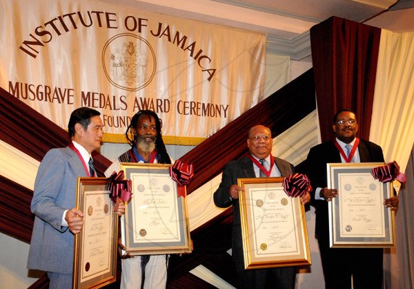 Winston Sill/Freelance Photographer
The Institute of Jamaica (IOJ) presents the Musgrave Medals Award Ceremony, held at The Institute's Complex, East Street, Kingston on Wednesday October 16, 2013. Here are Dr. Trevor Yee (left), Bronze Awardee; Earl "Chinna" Smith (second left), Silver Awardee; Prof. Franklin Knight (second right), Gold Awardee; and Prof. Michael Taylor (right), Silver Awardee.