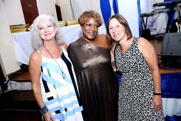 Rudolph Brown/PhotographerIt showed on their faces! (From left) Terry Newton, Michelle Wilson-Reynolds and Anne-Marie Hiskes, were having a great time at the Mustard Seed communities 40th anniversary awards and banquet.at the St. Peter and Paul Church Hall on Saturday, September 8, 2018