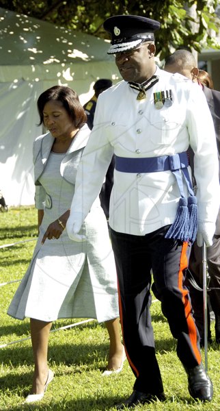 Ricardo Makyn/Staff Photographer.
Police Commissioner Owen Ellington escorts Lady Allen to the area for dignitaries.





Ceremony of Investiture and presentation of National Awards 2010 at Kings House