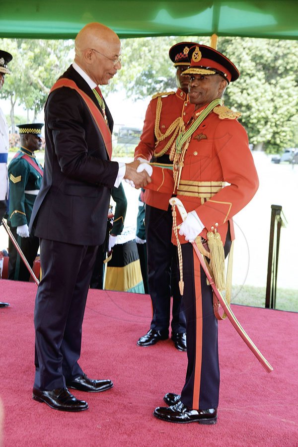 Lionel Rookwood/PhotographerMajor Rocky Ricardo Meade recieves The Order Of Distinction in the rank of Commander for distinguished service to the Jamaica Defence Force from Governor General Sir Patrick Allen at The National Honours and Awards Ceremony held at King's House on Monday October16th,2017. *** Local Caption *** Lionel Rookwood/PhotographerMajor Rocky Ricardo Meade receives The Order Of Distinction in the rank of Commander for distinguished service to the Jamaica Defence Force from Governor General Sir Patrick Allen at The National Honours and Awards Ceremony held at King's House, yesterday.