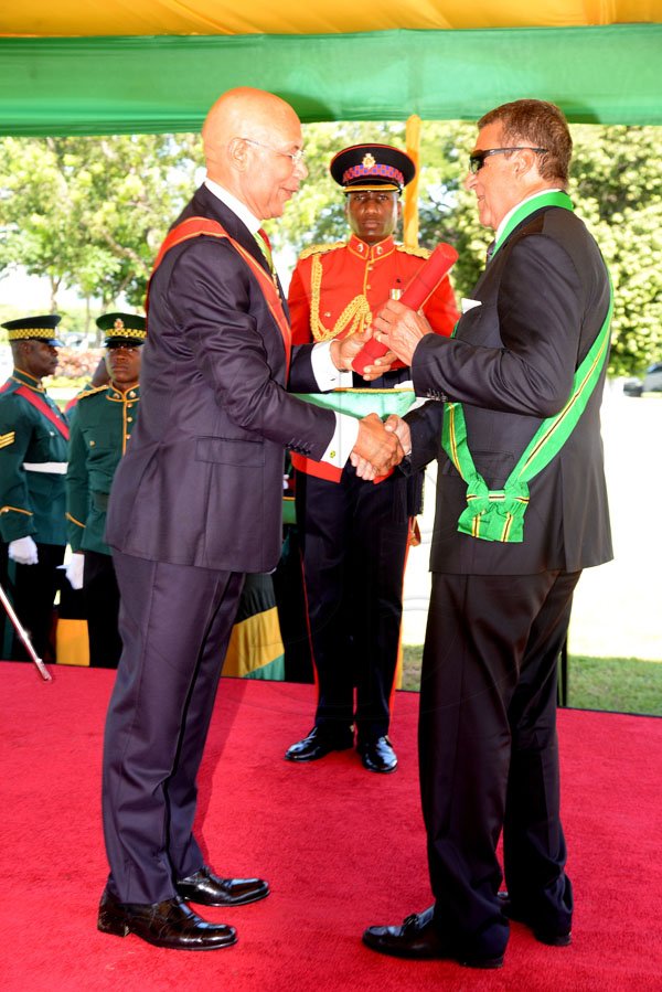 Lionel Rookwood/PhotographerPhillip Fredrick Gore recieves The Order Of Jamaica fron Governor General Sir Patrick Allen at The National Awards held at King's House on Monday October16th,2017.